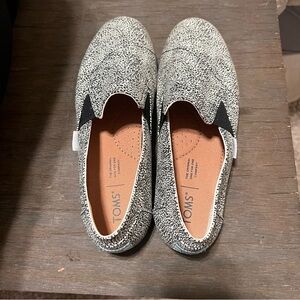 TOMS Speckled Black and White Slip-Ons